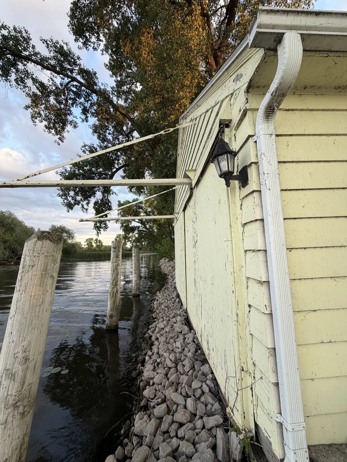 Boathouse over the water, before
