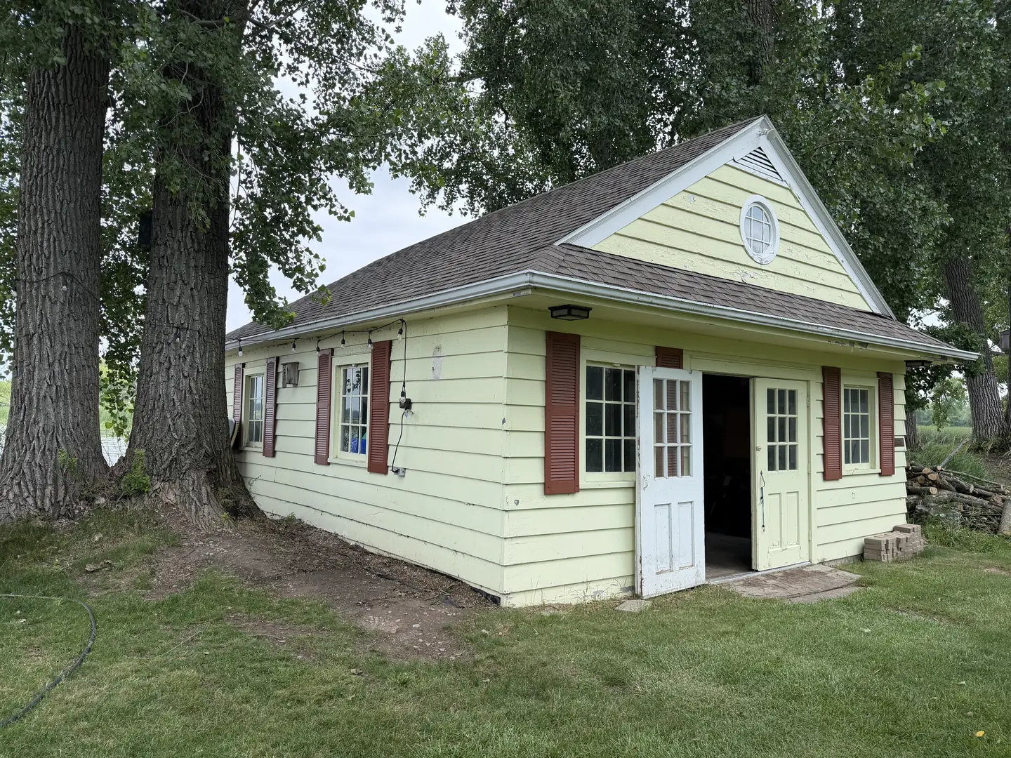 Lakeside boathouse, full exterior repaint, before